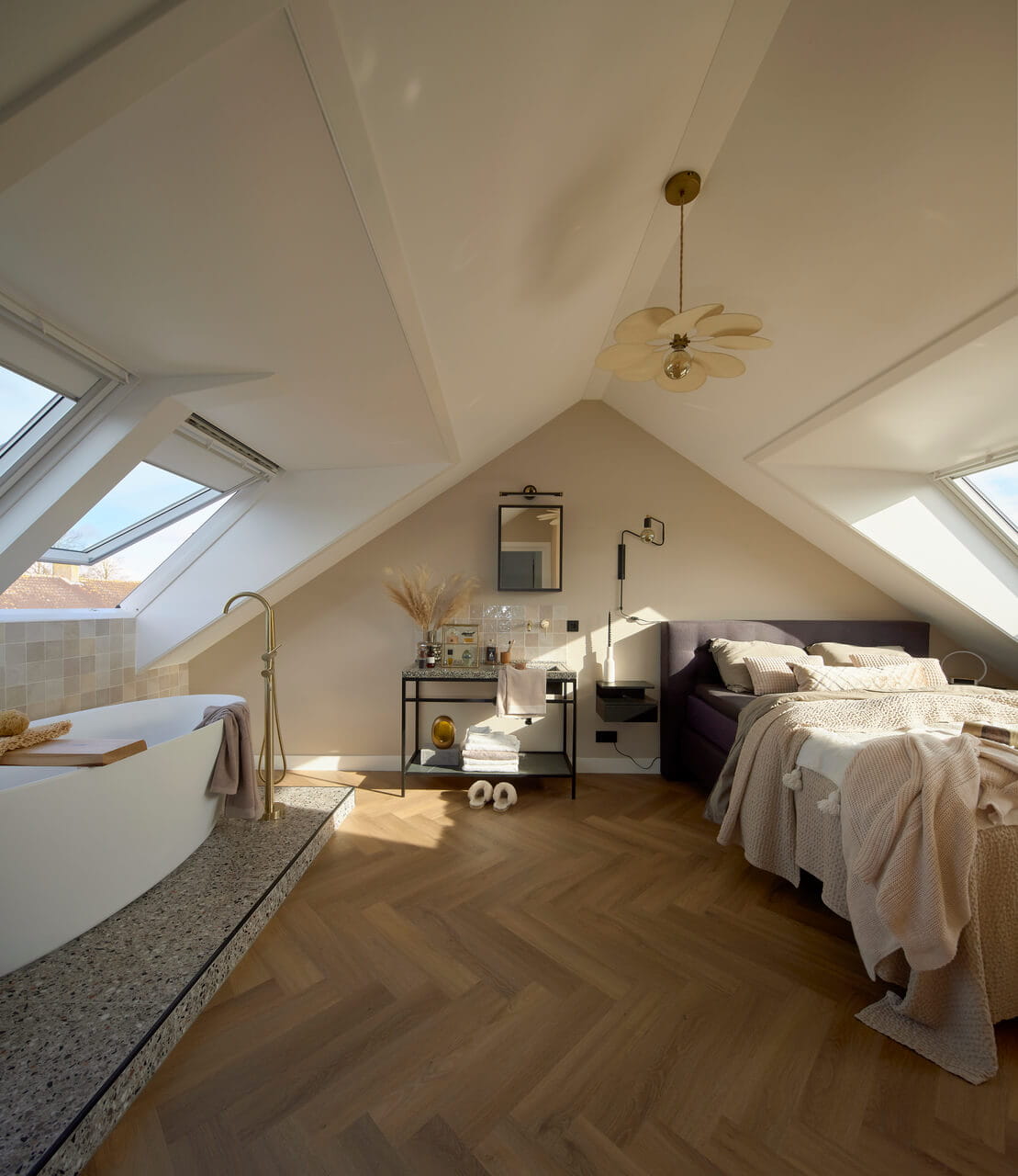 Attic with a bed and bath tub in one area.