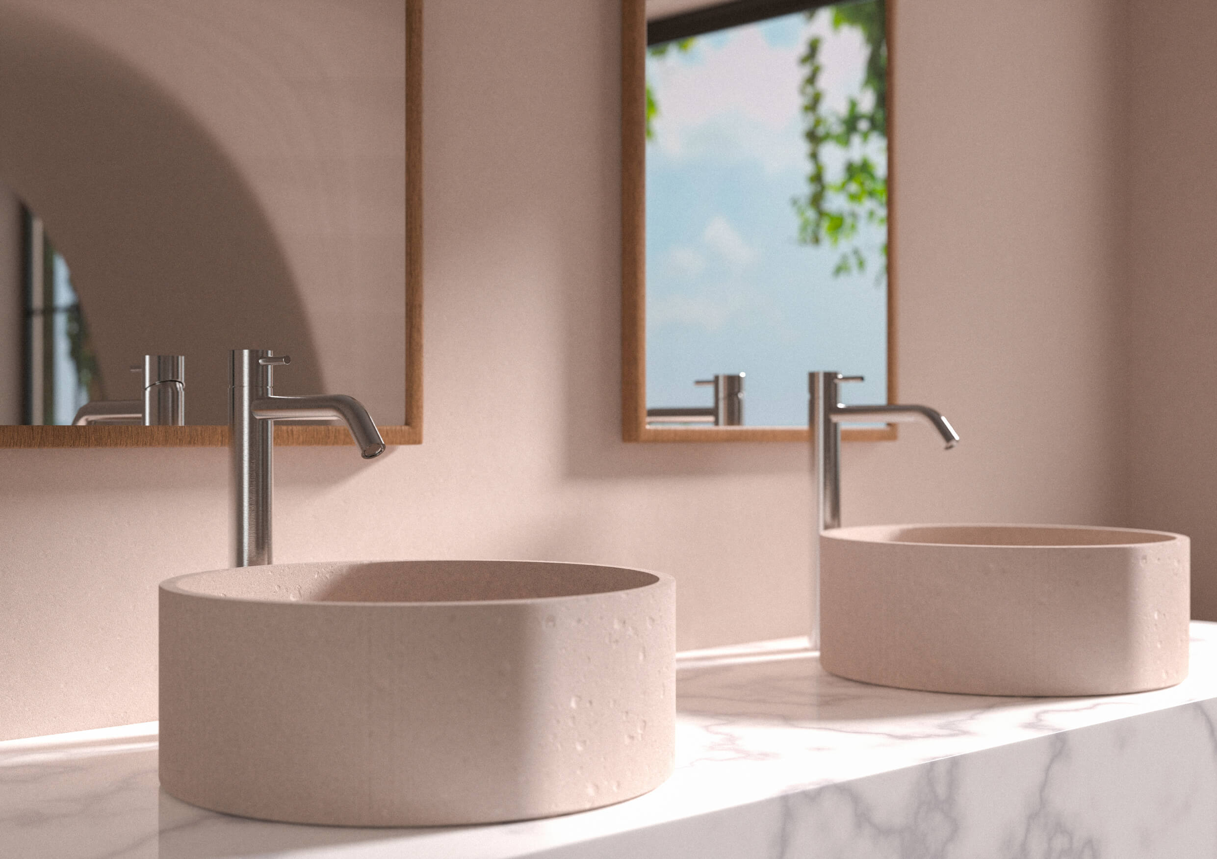 Modernes Badezimmer mit runden Steinspülen, Edelstahlarmaturen und einer Aussicht auf Grünanlagen.