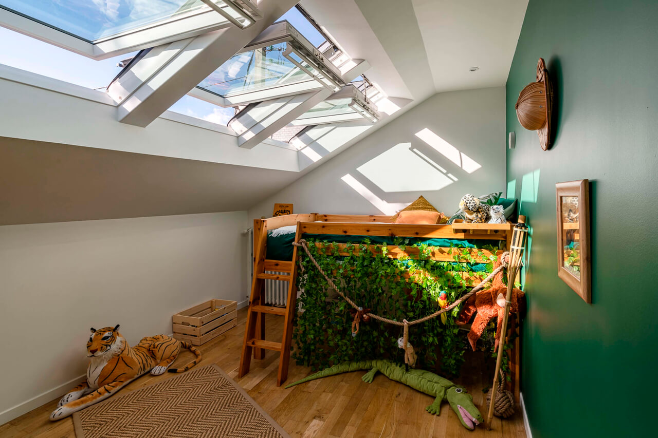 Colourful kids room with a big 3in1 roof window side image
