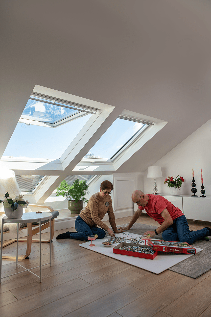Realising the potential of the attic - couple working on a jigsaw
