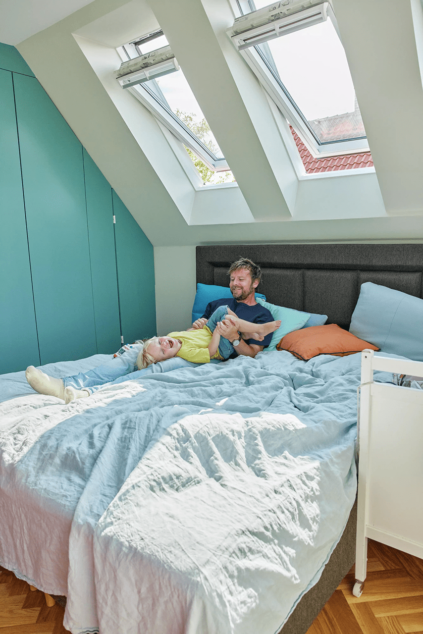 attic to room loft conversion-dad on bed with child